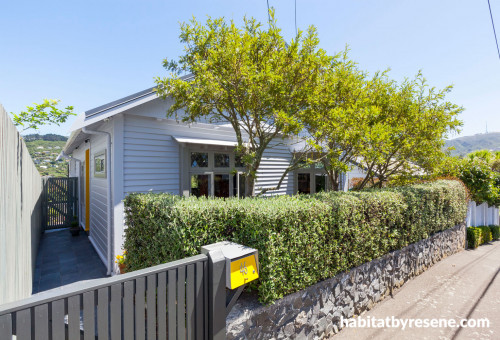 front exterior, house exterior, renovated villa, grey house, yellow front door 