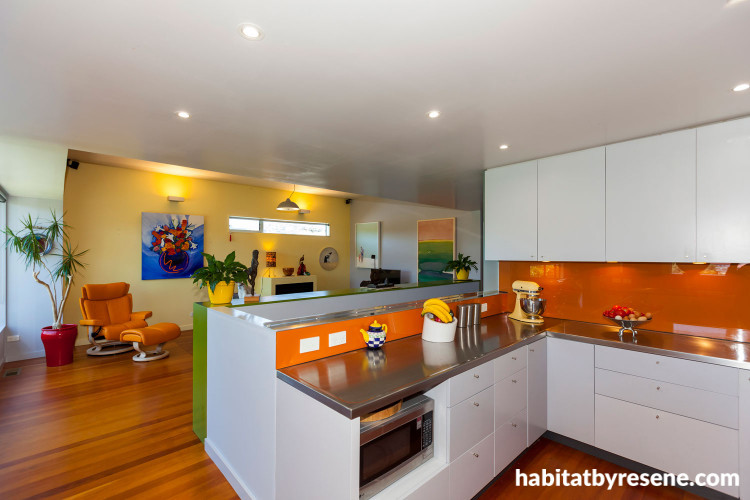 kitchen, dining room, orange splashback, bright kitchen, yellow feature wall, renovated villa