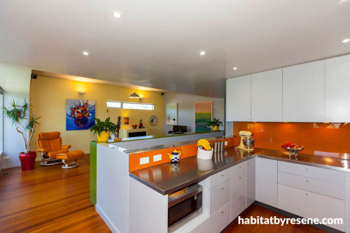kitchen, dining room, orange splashback, bright kitchen, yellow feature wall, renovated villa