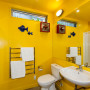 yellow bathroom, painted bathroom, bright bathroom, renovated villa, yellow paint