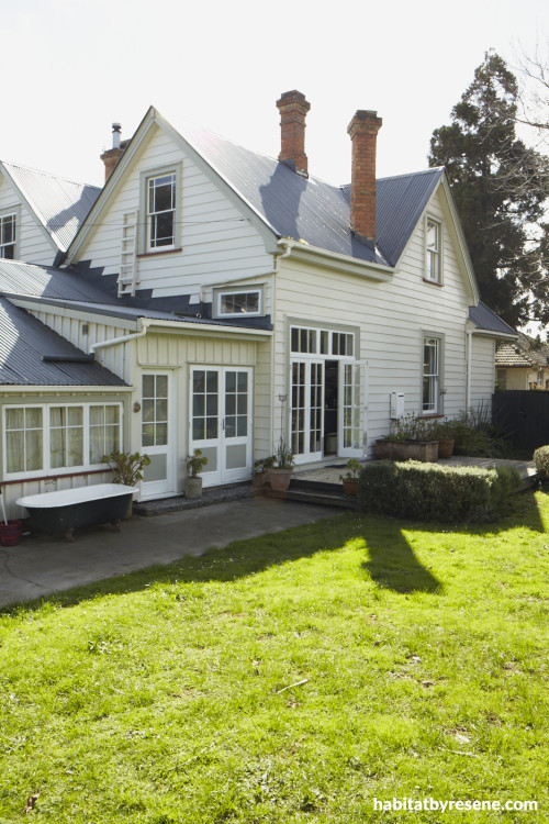 house exterior, green house, green painted weatherboards, neutrals, garden, white house
