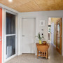 entranceway, red front door, yellow entranceway, plywood ceiling, colourful entranceway
