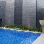 swimming pool, outdoor pool, exterior, water feature, grey wall, grey tiles