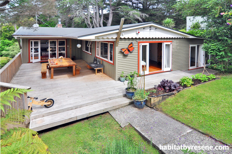 house exterior, painted weatherboards, deck, outdoor living, burnt orange