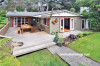 house exterior, painted weatherboards, deck, outdoor living, burnt orange 