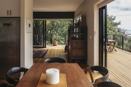dining room, deck, indoor outdoor flow, stained deck, neutral interior, beige dining room