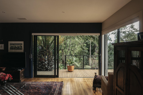 blue living room, blue lounge, blue feature wall, resene midnight express, stained deck