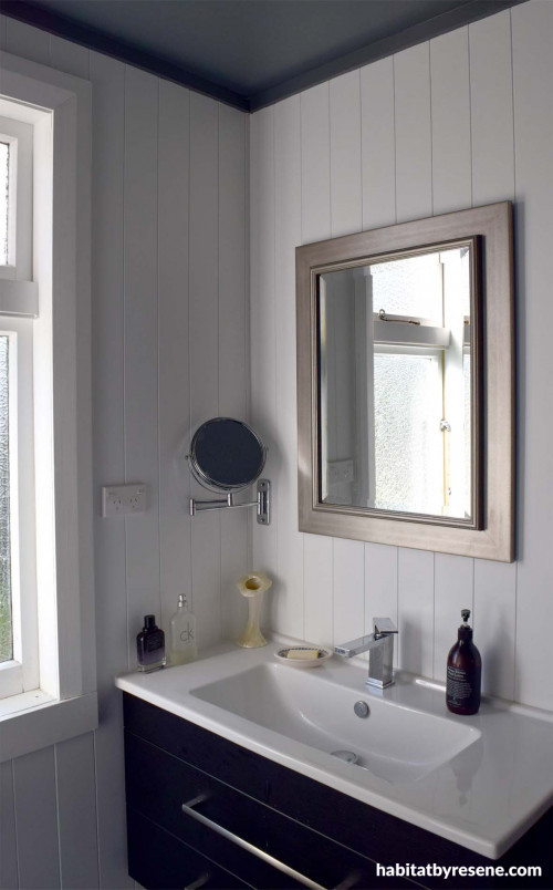 bathroom, grey ceiling, white bathroom, blue cabinet, blue and white, white and grey