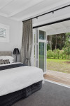A classically-styled Matarangi bach makes the most of open-plan living