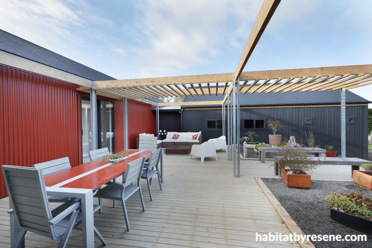 house exterior, deck, corrugated iron exterior, outdoor living, outdoor dining, red exterior