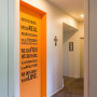 entranceway, hallway, orange paint, writing on walls, interior design, white paint