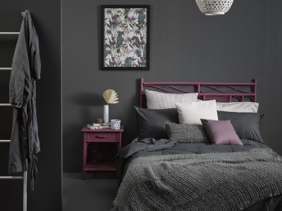 A sophisticated slate bedroom gets a tropical twist