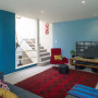 family room, lounge, living room, blue lounge, blue and red, colourful living room