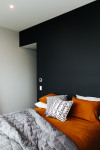 This striking black kitchen is the crown jewel of a contemporary North Otago farmstead
