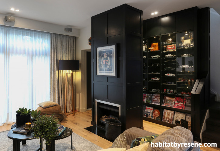 black fireplace, fireplace, black and white, lounge, living room, black feature wall