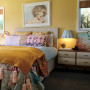 master bedroom, gold bedroom, yellow bedroom, gold feature wall, ochre bedroom