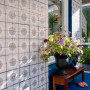 conservatory, patterned tiles, tiled feature wall, painted tiles, blue floor, blue conservatory