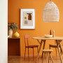 dining room, orange dining room, orange feature wall, 70s inspiration, rattan pendant