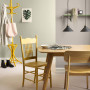 dining room, green dining room, yellow coat rack, entranceway, wood dining