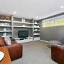 Lounge, living room, grey interior, grey and white, shelving, couch, brown
