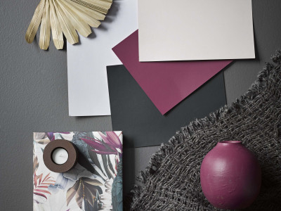 A sophisticated slate bedroom gets a tropical twist