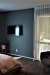 Jen and Dan’s blissful master bedroom sets the stage for more colour to come