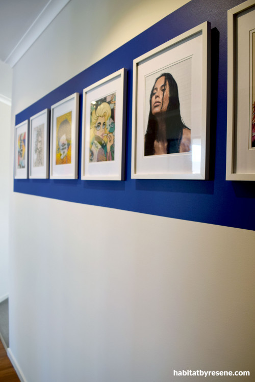 blue feature wall, hanging artwork, photography as art, white walls, blue paint, resene decadence