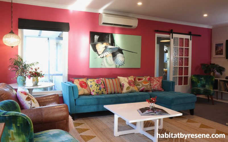 living room, lounge, pink lounge, pink feature wall, blue sofa, pink and blue, resene rouge