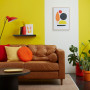 lounge, living room, yellow lounge, yellow living room, leather couch, yellow feature wall