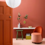 sitting room, study, home office, pink feature wall, pink room, pink floor, orange door