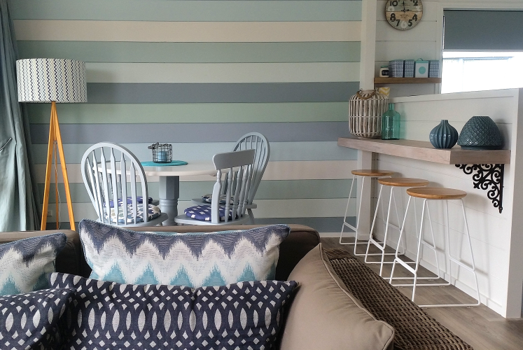 holiday house, feature wall, blue, living room, bach, beach house, stripe, stripes, paint ideas