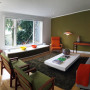 lounge, living room, green feature wall, retro furniture, green lounge, green paint 