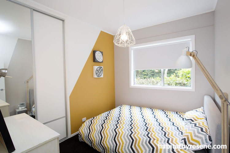 bedroom, orange bedroom, orange paint, feature wall, geometric pattern, white bedroom
