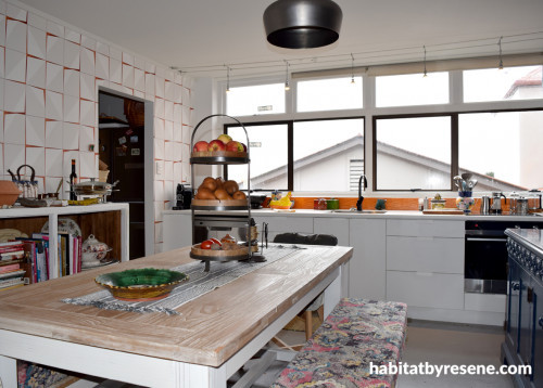 kitchen, geometric wallpaper, wallpaper feature wall, orange and white kitchen, resene sea fog