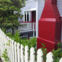 house exterior, villa exterior, painted weatherboards, red chimney