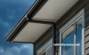 black house, house exterior, black downpipes, cedar weatherboards, stained weatherboards 