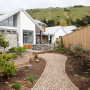 bungalow, exterior, cedar cladding, stone exterior, white house, garden 