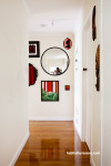 hallway, entrance way, white painted hallway, mirror feature wall, interior, home decorating ideas 