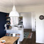 kitchen, dining room, white kitchen, blue dining, navy feature wall, resene biscay, blue and white
