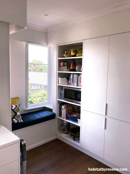 window seat, kitchen, kitchen window seat, white cabinetry, white kitchen, navy and blue