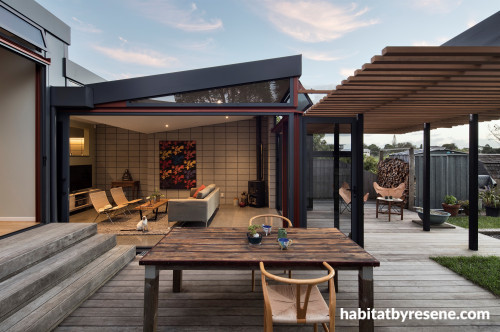 villa renovation, deck, outdoor living, outdoor dining, concrete floors, black roofing, exterior