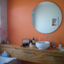 bach, holiday home, beach house, bathroom, orange bathroom, orange feature wall, bright bathroom