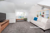 white living area, white lounge, white paint, custom shelving, blue paint 