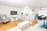 white kitchen, white living room, white lounge, white paint, blue furnishings, timber floorboards