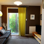 living room, lounge, brown paint, white living room, feature wall, retro lounge