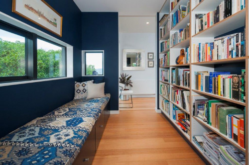 library, blue interiors, reading nook, bookshelves, window seat, paint ideas