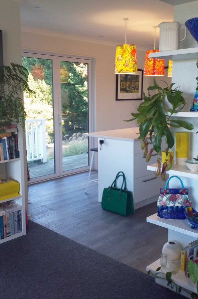 A funeral assistant looks on the bright side of life using bold Resene Scrumptious and Resene Fizz in her home