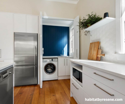 White kitchen blue laundry