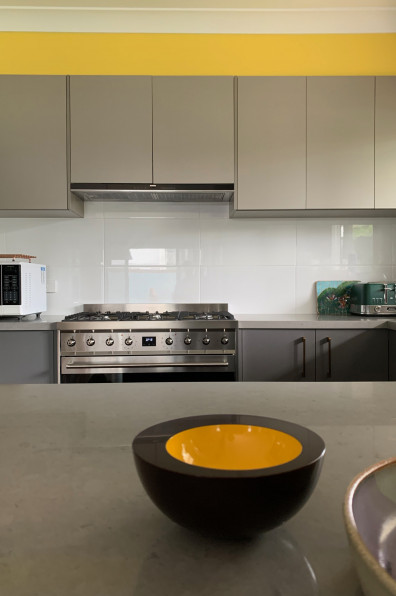 This artist’s Brisbane home is so colourful even the 85m fence is an elegant rainbow