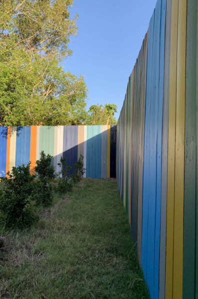 This artist’s Brisbane home is so colourful even the 85m fence is an elegant rainbow This artist’s Brisbane home is so colourful even the 85m fence is an elegant rainbow